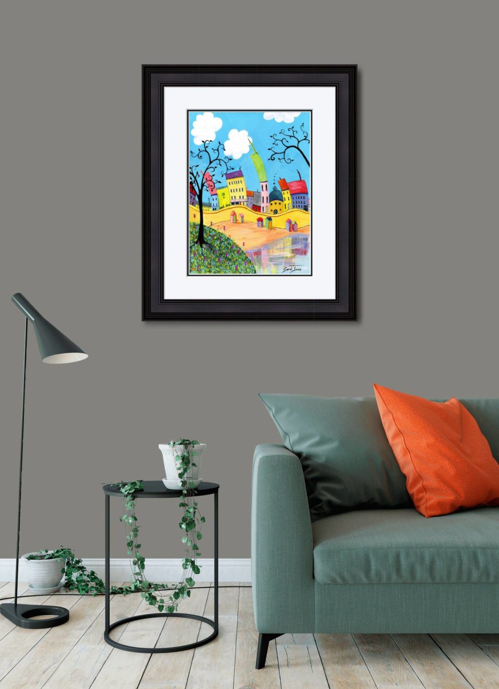 A House By The Sea Print In Black Frame In Room
