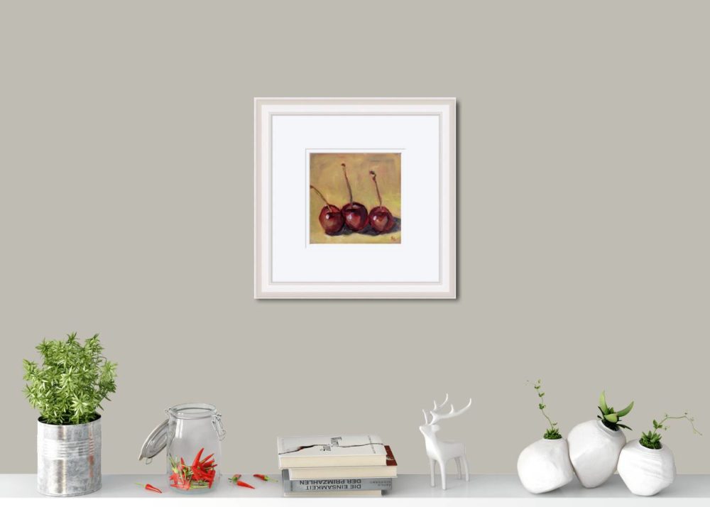 Cherries In White Frame In Room